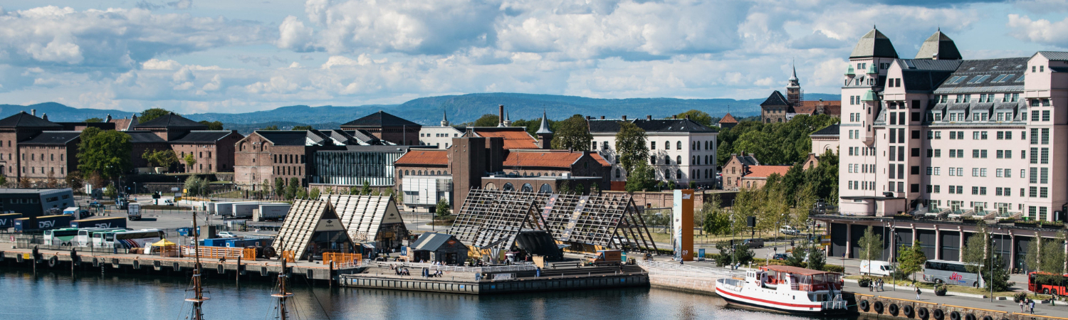Lot of buildings on the coast of a sea near Akershus Fortress in Oslo, Norway